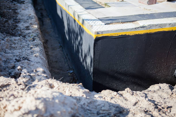 Professional Waterproofing technician working in Troy, NC
